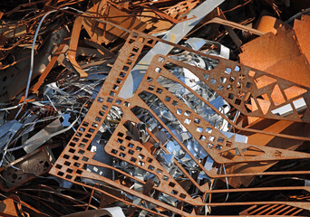 rusty scrap in a recycling shop where ferrous material residues are collected - obrazy, fototapety, plakaty