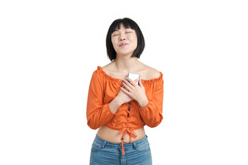 Young asian woman hugging her smartphone, isolated.