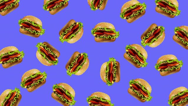 Minimal motion design - Tasty burgers rotating and moving down at violet color background. Trendy colors and style graphics. Seamless looping animation.