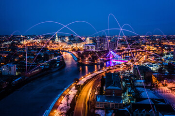 Fototapeta na wymiar Concept of 5g networks in large digital citiy. Night cityscape with global connection technology design. Media technology innovation