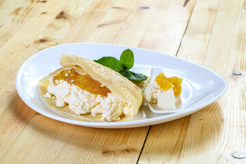 Pancake with cottage cheese and jam