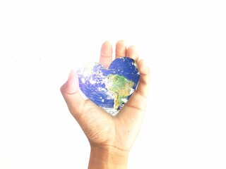 heart shaped world in hand  Elements of this image furnished by NASA.