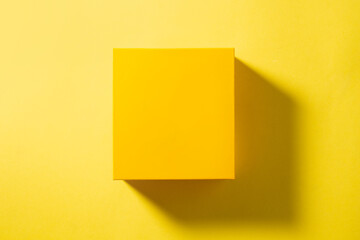 Top view of yellow box on yellow background