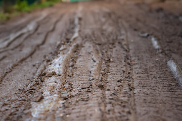 Mud on the road, dirt road in spring, rural dirt road after rains in spring,