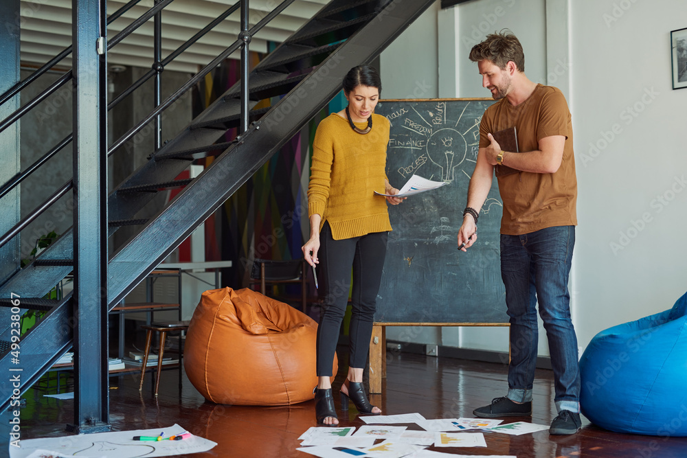 Aufkleber Always have a point of view. Shot of two designers discussing something in an office.