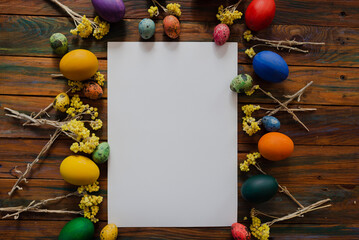 Easter eggs mocap on old wooden background