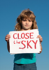 Close the sky over Ukraine banner. No fly zone over Ukraine.