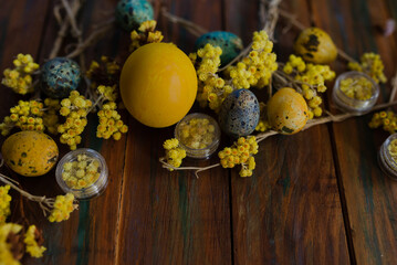 Obraz na płótnie Canvas Easter eggs on a wooden background. Concept