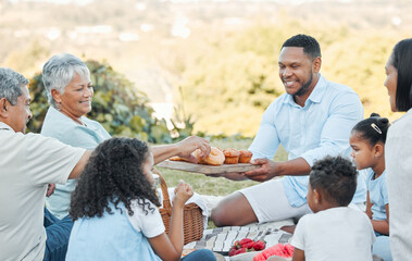 Family and friends are hidden treasures. Shot of a family enjoying a picnic in a park.