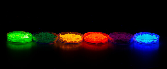 Fluorescent organic materials powder of red, yellow, green color for production OLED inside of glasses bottles in UV light.