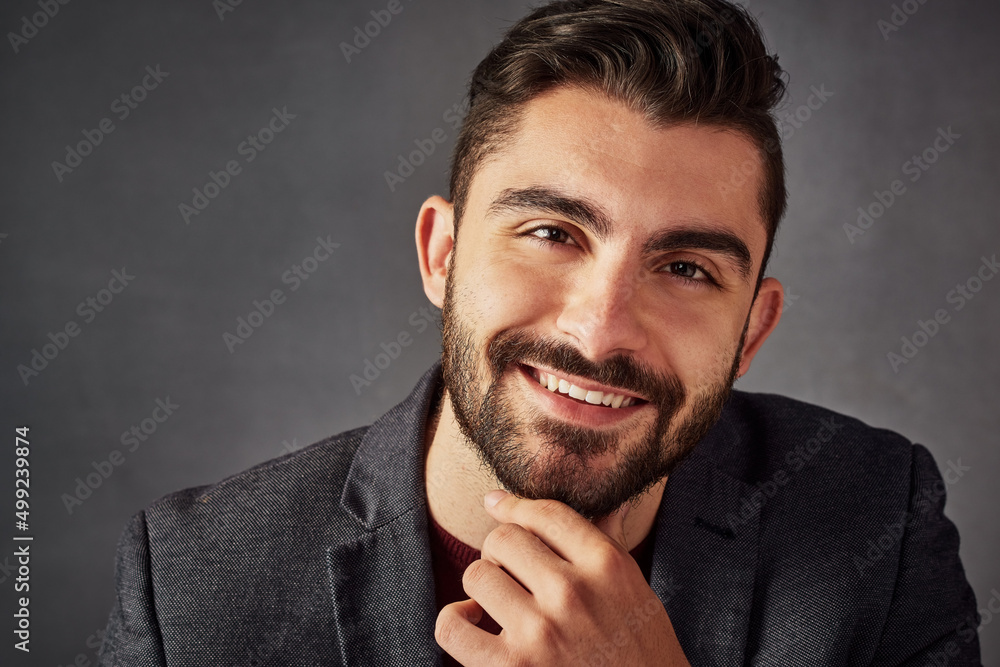 Poster whats there not to like. studio portrait of a handsome young man posing against a dark background.