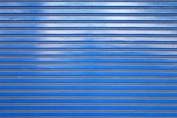blue metal roller shutter door, corrugated steel sheet of storefront gate