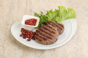 Grilled beef burger cutlet with sauce