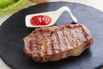 Grilled rib-eye steak beef meat