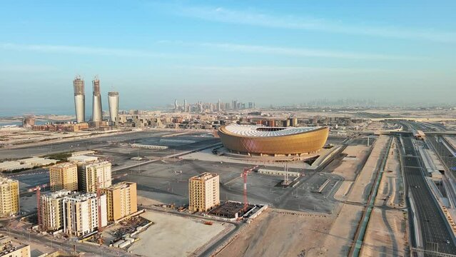 Doha, Qatar: Aerial view of capital city of Qatar, cityscape with skyscrapers skyline of Lusail district on horizon - landscape panorama of Arabian Peninsula from above, West Asia
