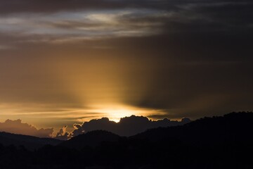 Sunrise over the mountains, silhouette of the mountains, sky, clouds. Santa Ponca, Mallorca, Spain.	
