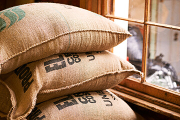 Fototapeta na wymiar The essence of the coffee industry. Shot of a burlap sack full of unprocessed coffee beans.