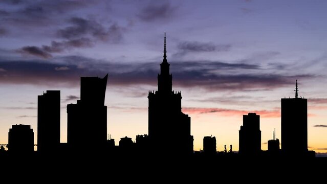 Skyline of Warsaw, Capital of Poland, Time Lapse at Twilight with Colourful Sky and Dark Silhouette of Downtown