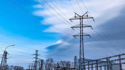high-voltage power lines at sunset,high voltage electric transmission tower