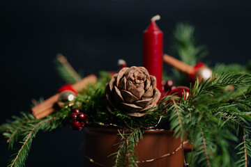 beautiful Christmas composition in a mug with a candle