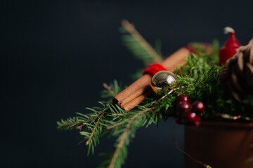 beautiful Christmas composition in a mug with a candle