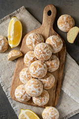 Lemon gingerbread on a serving wooden board on a dark culinary background. Delicious homemade cookies	