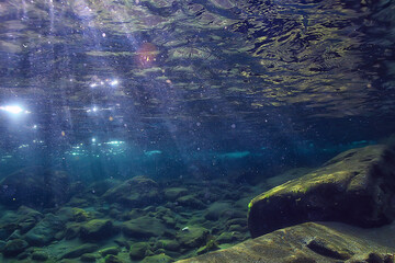 ocean underwater rays of light background, under blue water sunlight