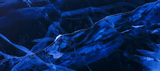 Naklejka premium ice texture cracks baikal, abstract background winter ice transparent blue