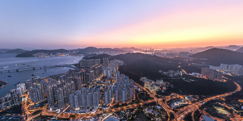Obraz na płótnie Canvas Panorama aerial view of Hong Kong crowded building at magic hour