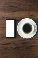 Fototapeta na wymiar office desk with coffee and smartphone on the wood background.mock up 