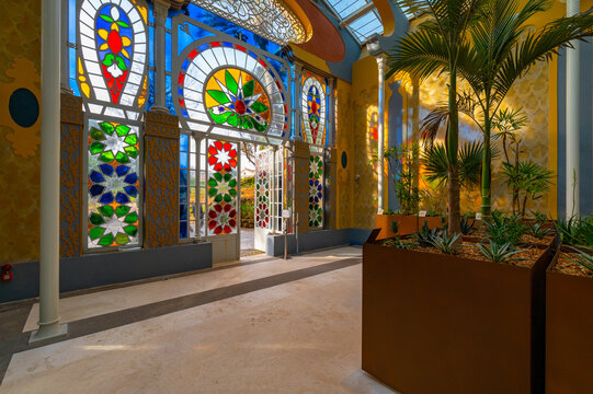 The Serra Moresca is inspired by the Alhambra in Grenada. The polychrome glasses of the facade creates wonderful reflections and plays of light. It is part of the Villa Torlonia Park in Rome, Italy.