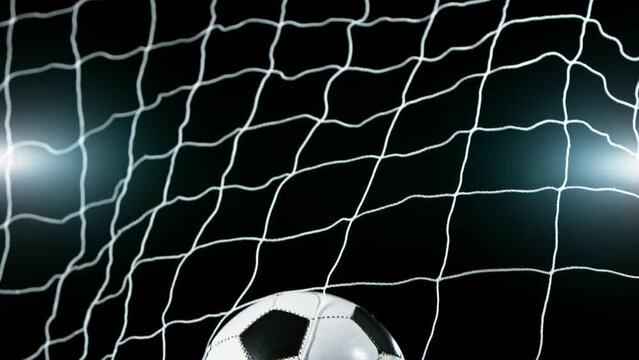 Super slow motion of soccer ball flying into goal. Filmed on high speed cinema camera, 1000fps. Speed ramp effect.