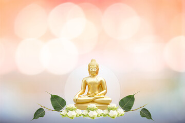 Vesak day concept: Buddha statue on bokeh background.