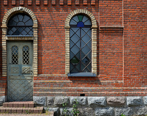 Fototapeta na wymiar General view and architectural details of a close-up of the Catholic church of St. Michael the Archangel built at the turn of the 19th and 20th centuries in Jabłonka Koscielna in Podlasie, Poland.