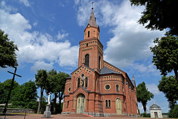 Obraz premium General view and architectural details of a close-up of the Catholic church of St. Michael the Archangel built at the turn of the 19th and 20th centuries in Jabłonka Koscielna in Podlasie, Poland.