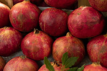 red pomergranates in a market
