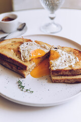 Croque madame, french toast with poached egg, ham and cheese