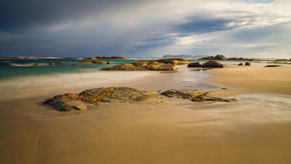 Beach with granite rocks and boulders in William Bay National Park, Western Australia
