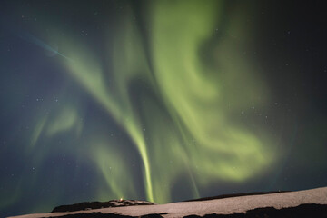 Fototapeta na wymiar Northern Lights (Aurora Borealis) in Norway during wintertime