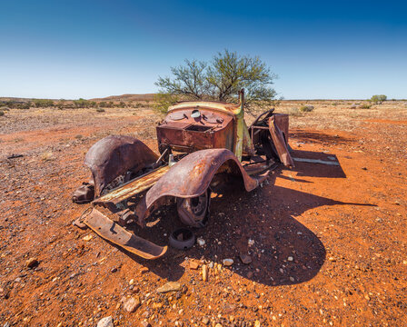 Gold Rush Ghost Town Nannine In Western Australia; Wreck Of An Abandoned Rusty Car In The Semi Desert 