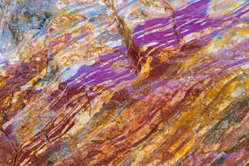 Close up of colourful layers of Jasper