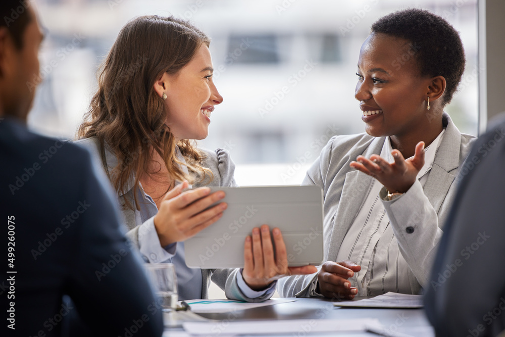 Poster i understand exactly what you mean. shot of two young businesswomen sitting together in the office a