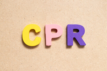 Color alphabet letter in word CPR (abbreviation of Cardiopulmonary resuscitation) on wood background