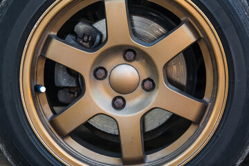 Bronze Car Max wheel with tire