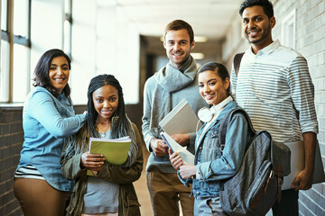 Campus clique. Cropped portrait of a group of university students standing in a campus corridor.