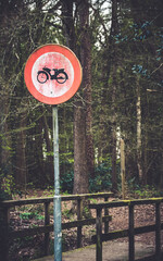 No scooter driving sign in the forest - obrazy, fototapety, plakaty