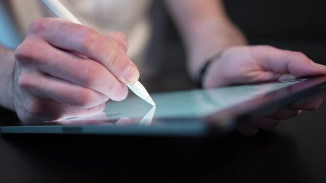 Closeup Taking Notes Writing With a Stylus Pen on Digital Tablet Screen