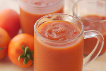  tomato sauce in a jar with fresh tomato on table 