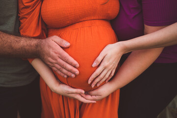 maternity photo shoot with hands on belly 