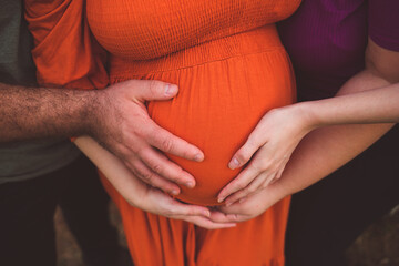 maternity photo shoot with hands on belly 